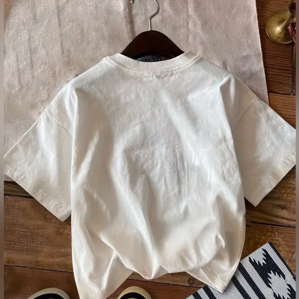 Good condition white graphic t shirt with great quality designs